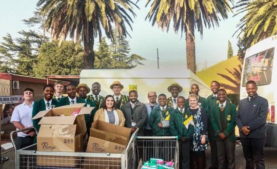 Students with the donations they brought Vita Nova