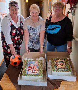 Vita Nova Staff with ice-cream cakes and sports balls donated by Ginger Brown